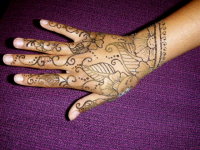 Traditional Arabic henna hand. Henna flowers in Orlando.
