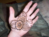 Bold henna hand in floral design. Henna in Orlando by Jody